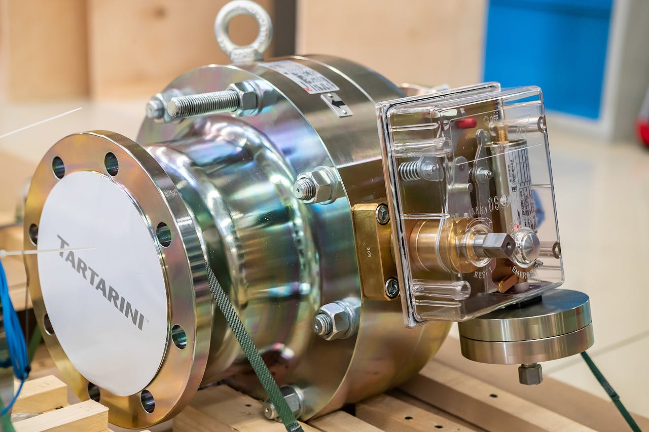 services-03 Detailed view of industrial valve machinery inside a workshop setting.